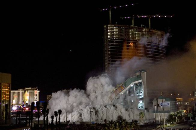 The New Frontier hotel tower crashes to the ground as it is imploded in Las Vegas, Nevada November 13, 2007. The casino on The Las Vegas Strip was purchased by Elad properties, an Israeli-owned real estate investment group, for more than U.S. $1.2 billion in May 2007. Elad Group, which also owns the Plaza hotel in New York, and the IDB Group are expected to build a Plaza-themed multi-billion  dollar megaresort on the site. 